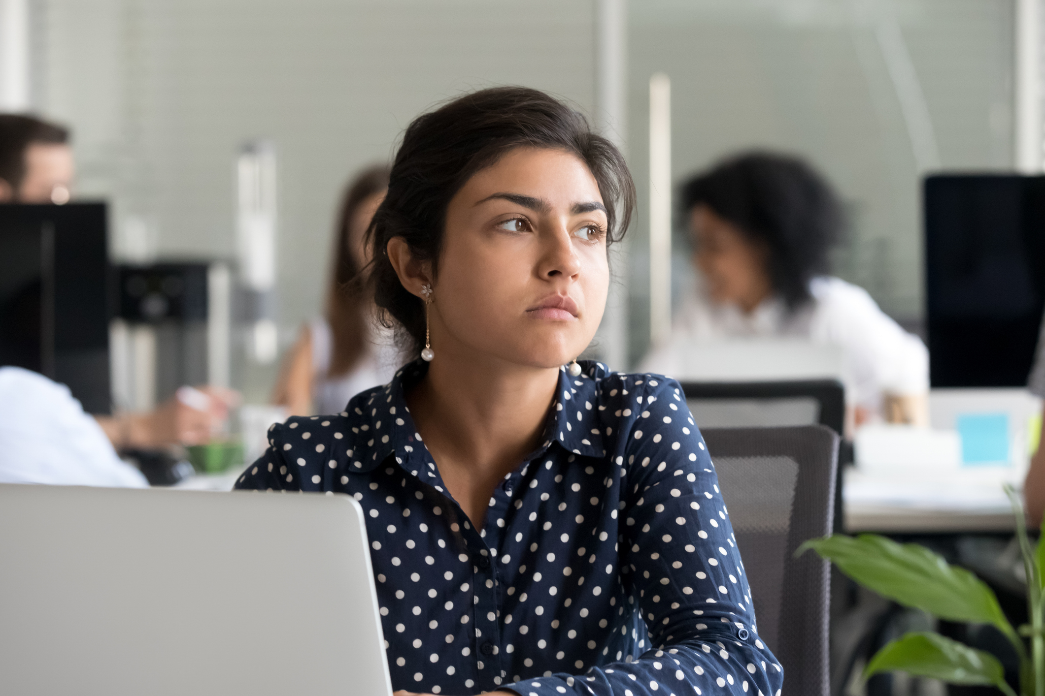 Quiet Work: A professional woman who looks frustrated.